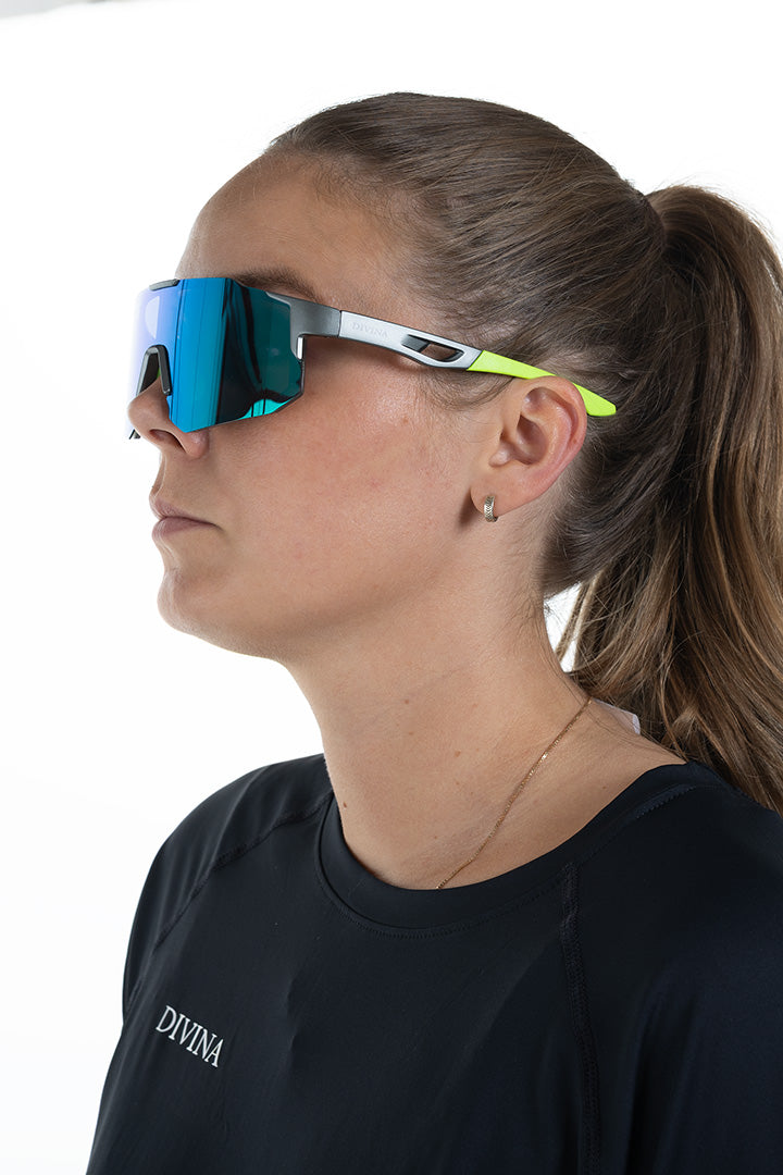 Girl with Grey/Green Sport Sunglasses with Green/Blue lens