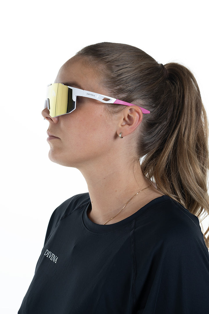 Woman with White/Pink Sport Sunglasses with Pink/Gold lens