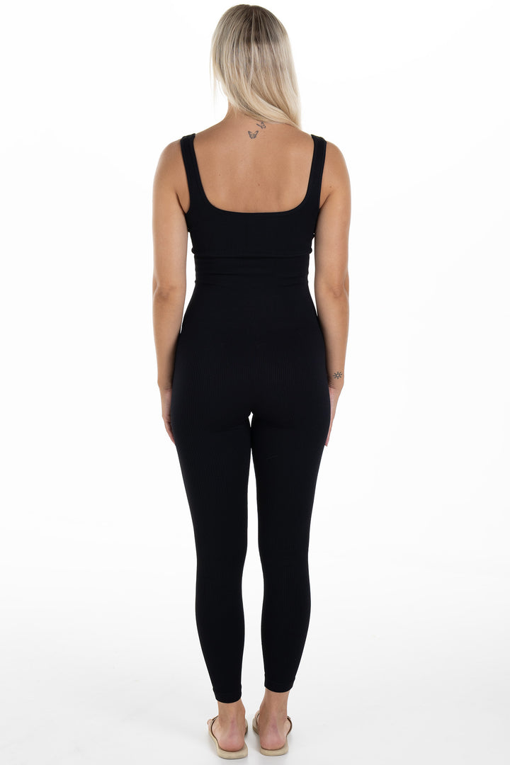Woman in Black Ribbed Jumpsuit Artus Back