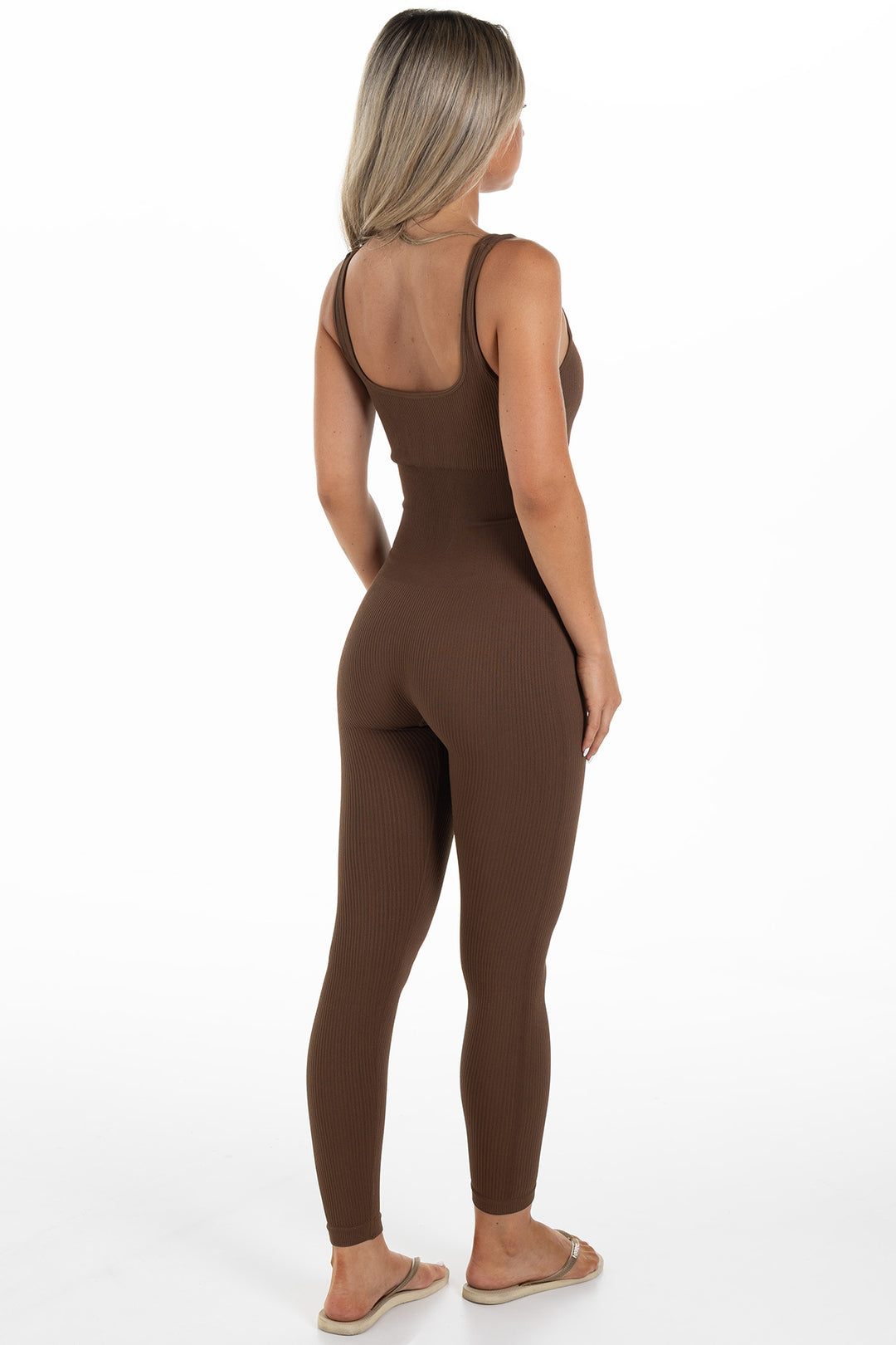 Woman in Brown Ribbed Jumpsuit Side