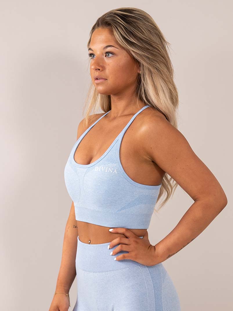 Four blue sports bra side