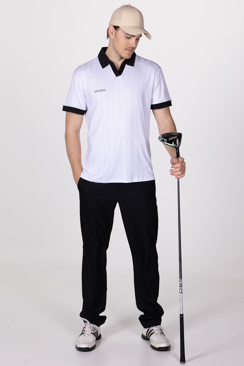 Male in White Golf Polo Ace from Divina Whole body with driver in hand