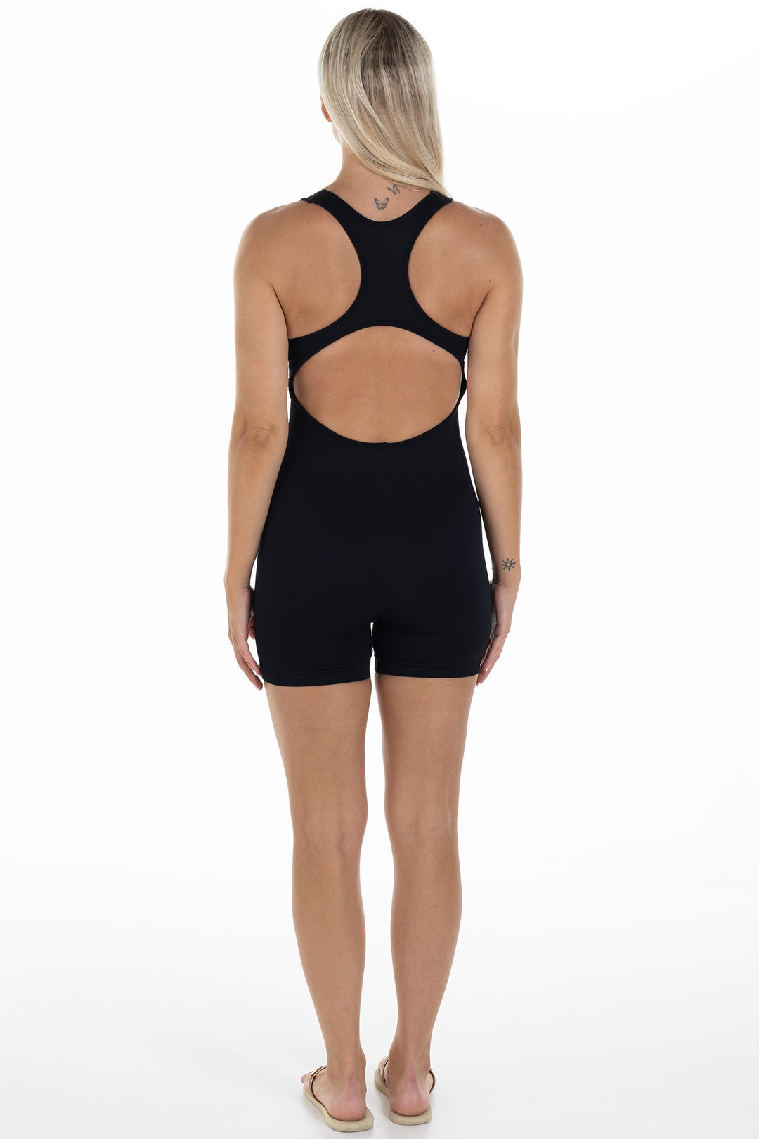 Woman in Black Ribbed Jumpsuit Julia Back