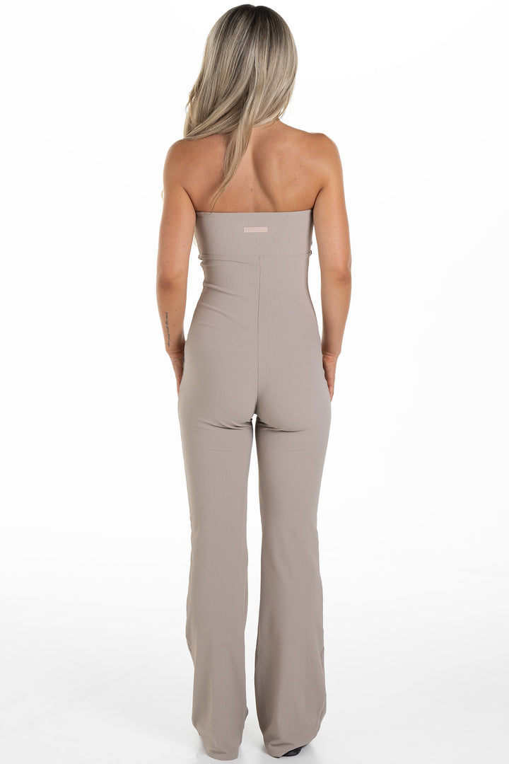 Woman in Beige Ribbed Jumpsuit Palma Back