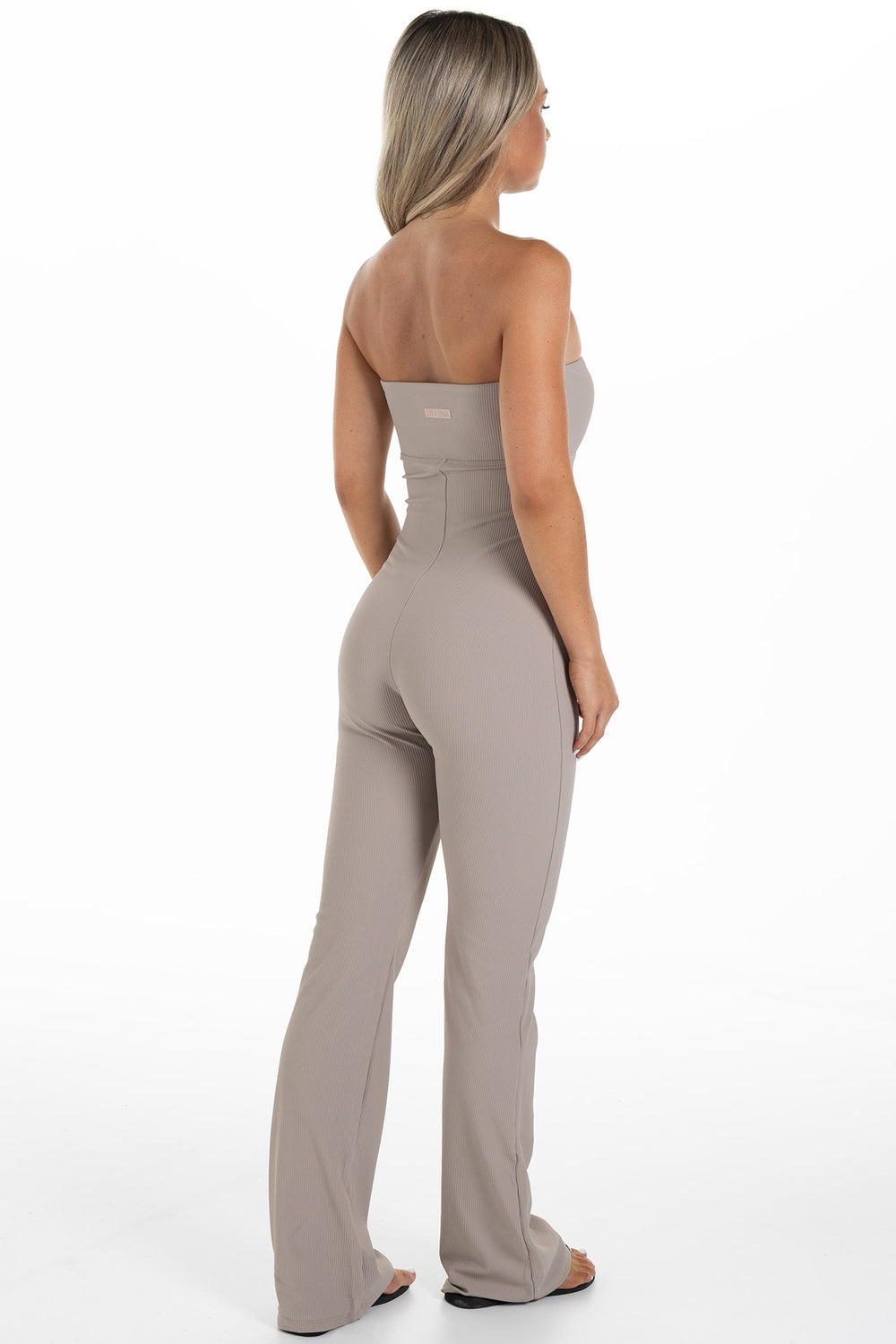 Woman in Beige Ribbed Jumpsuit Palma Side