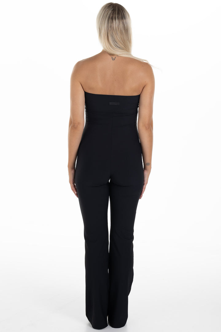 Woman in Black Ribbed Jumpsuit Palma Back