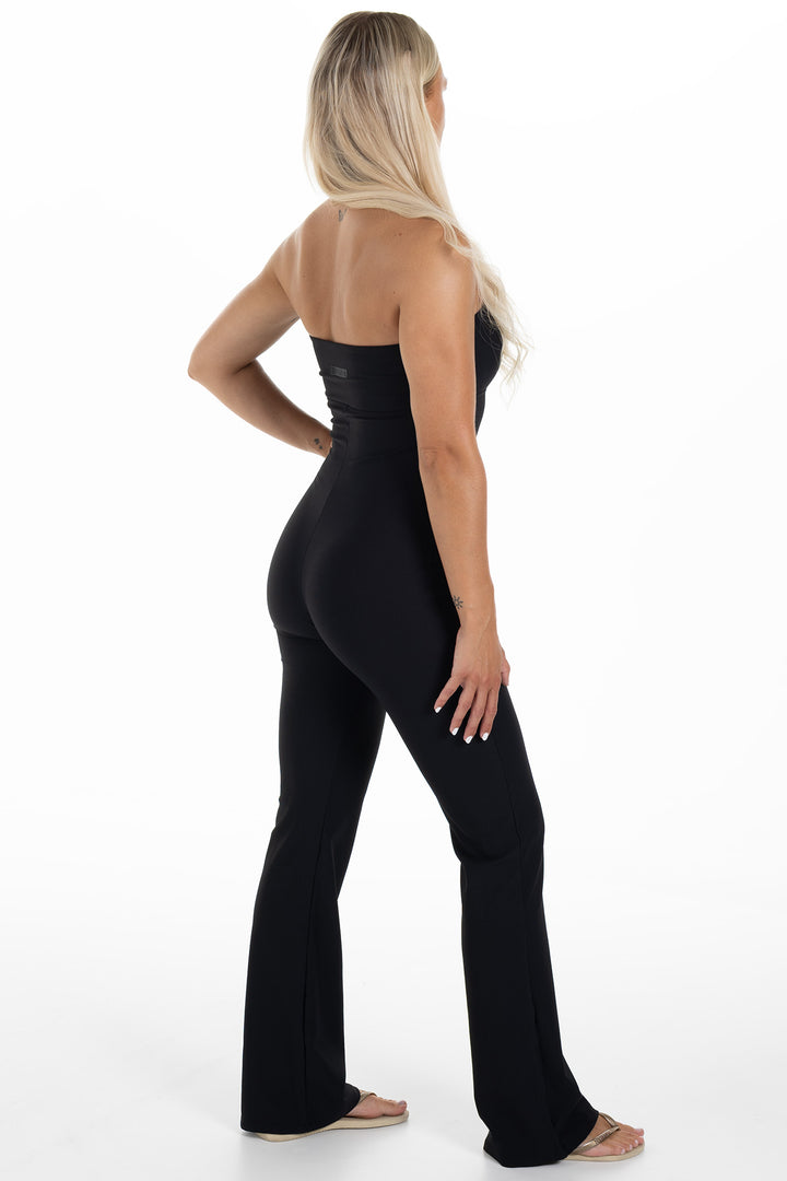Woman in Black Ribbed Jumpsuit Palma Side